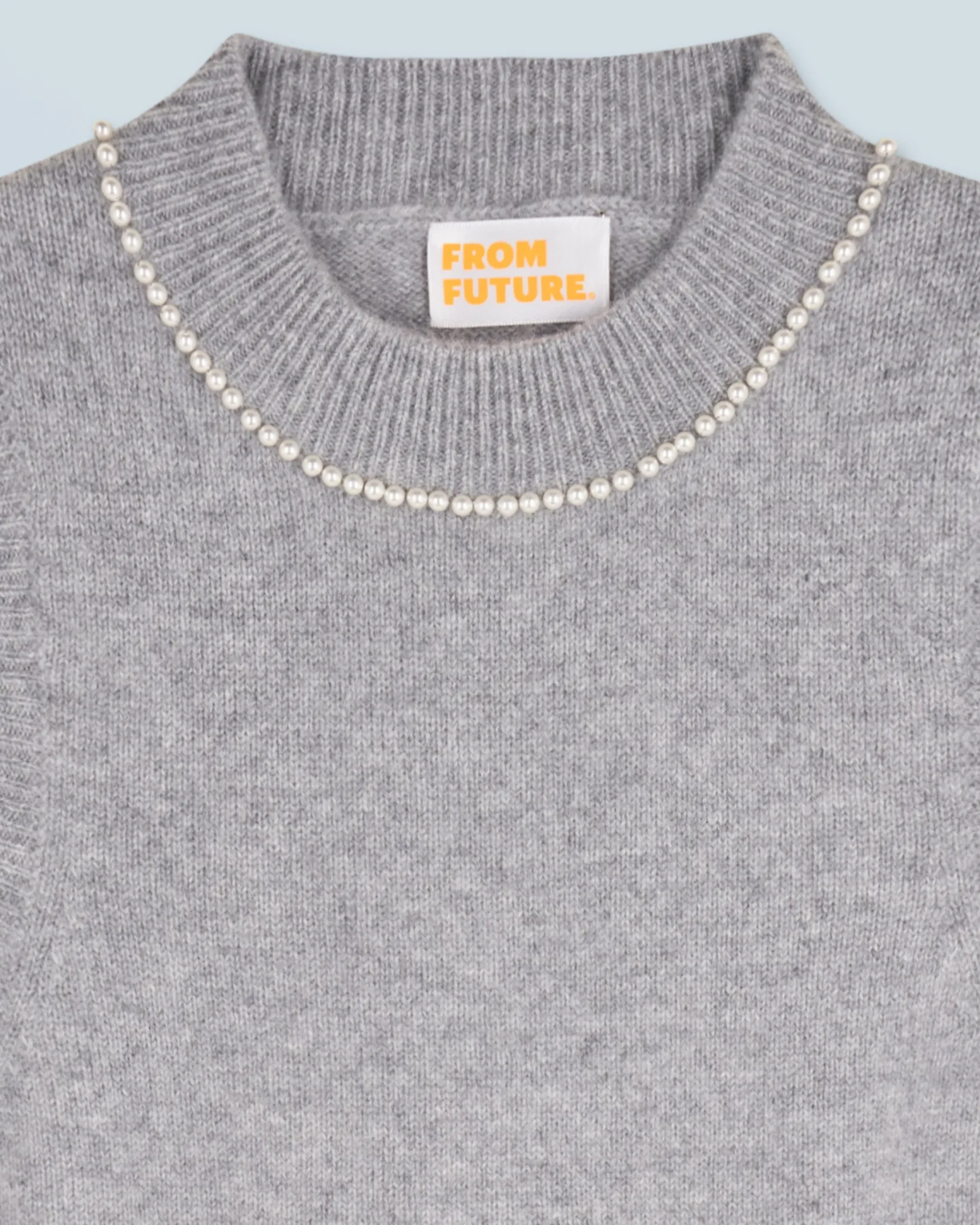 Sleeveless Sweater with Beads at the Neckline